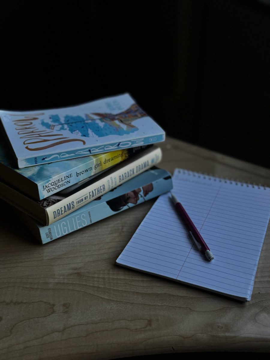 Stack of books and notebook